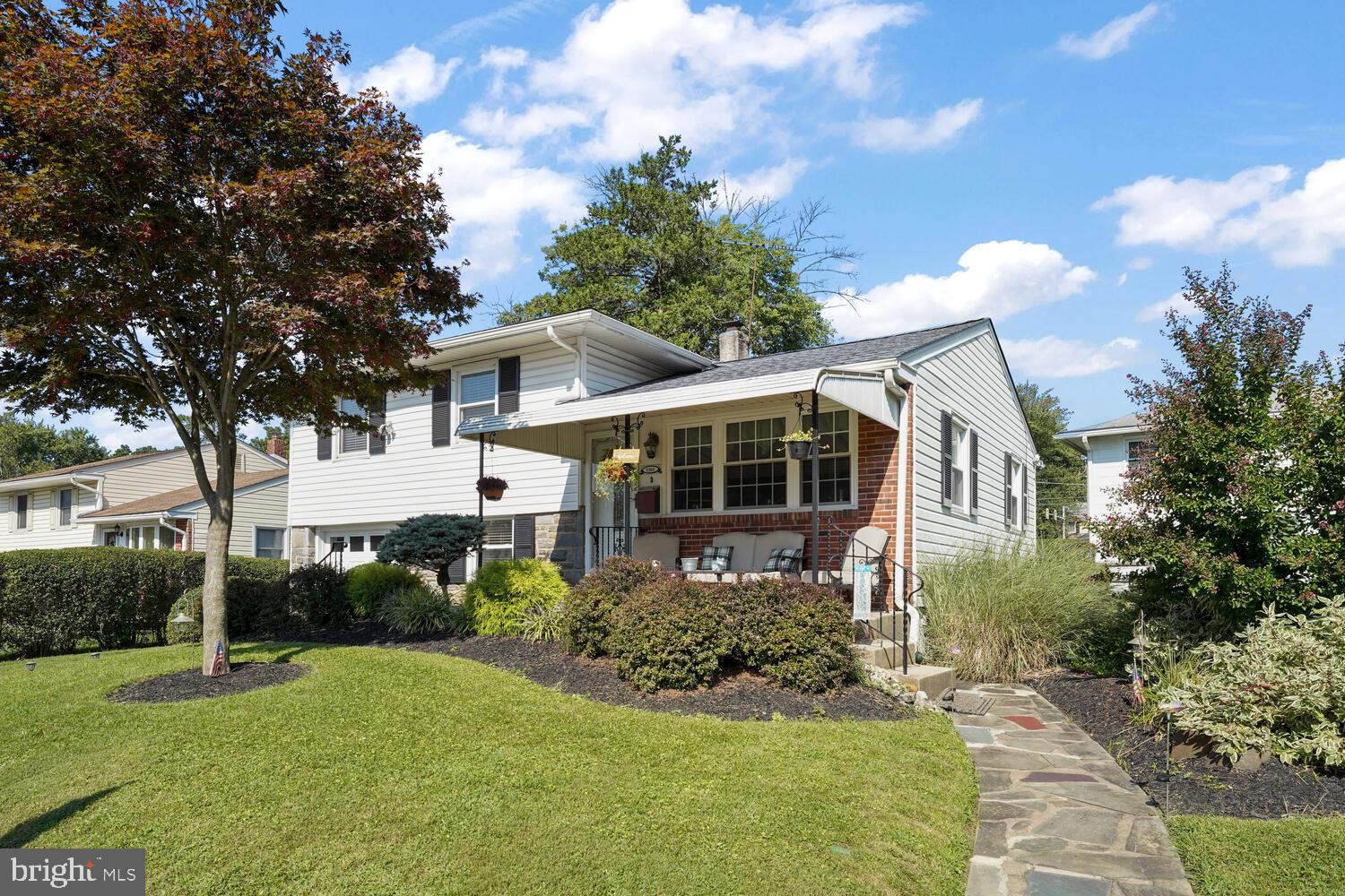 1101 Wynnbrook Road Secane, PA 19018 - Photo 1 of 19 a front view of a house with garden