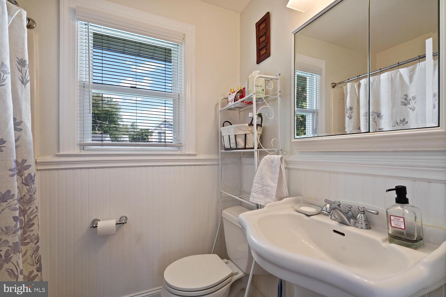 1101 Wynnbrook Road Secane, PA 19018 - Photo 13 of 19 a bathroom with a sink a toilet and a mirror