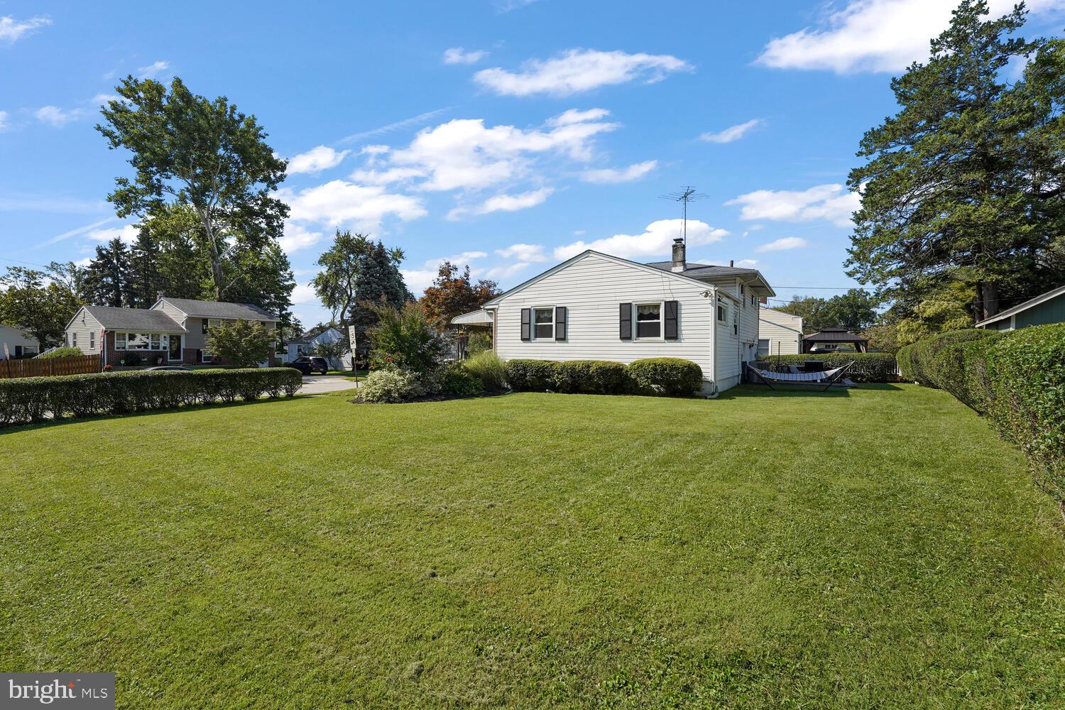 1101 Wynnbrook Road Secane, PA 19018 - Photo 15 of 19 a front view of a house with a garden