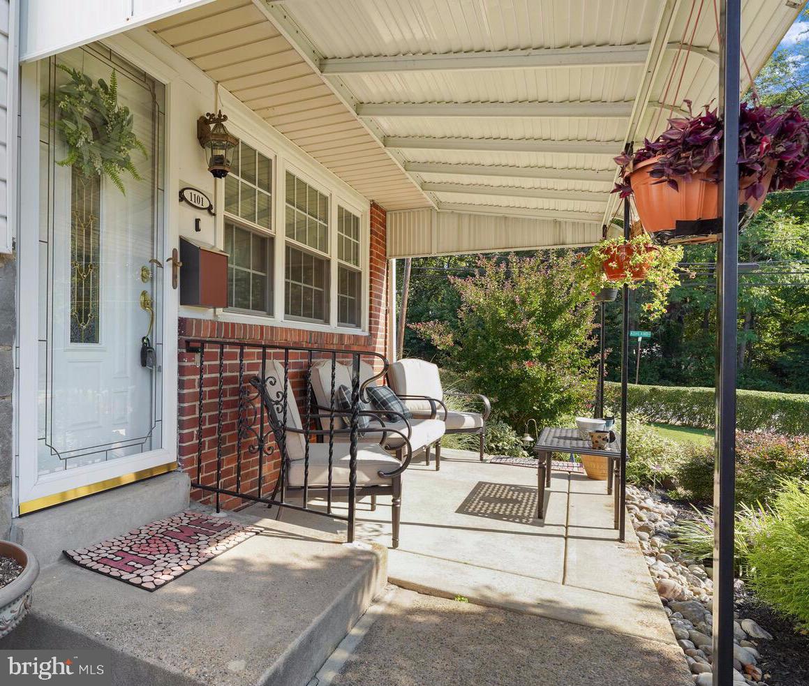 1101 Wynnbrook Road Secane, PA 19018 - Photo 19 of 19 a view of a patio with table and chairs and potted plants