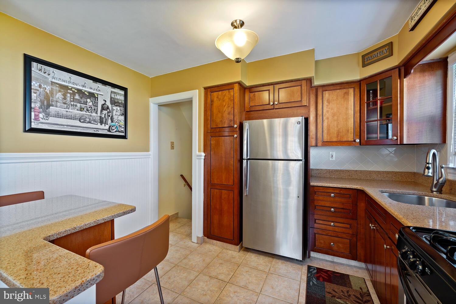 1101 Wynnbrook Road Secane, PA 19018 - Photo 6 of 19 a kitchen with stainless steel appliances granite countertop a refrigerator a sink and a stove