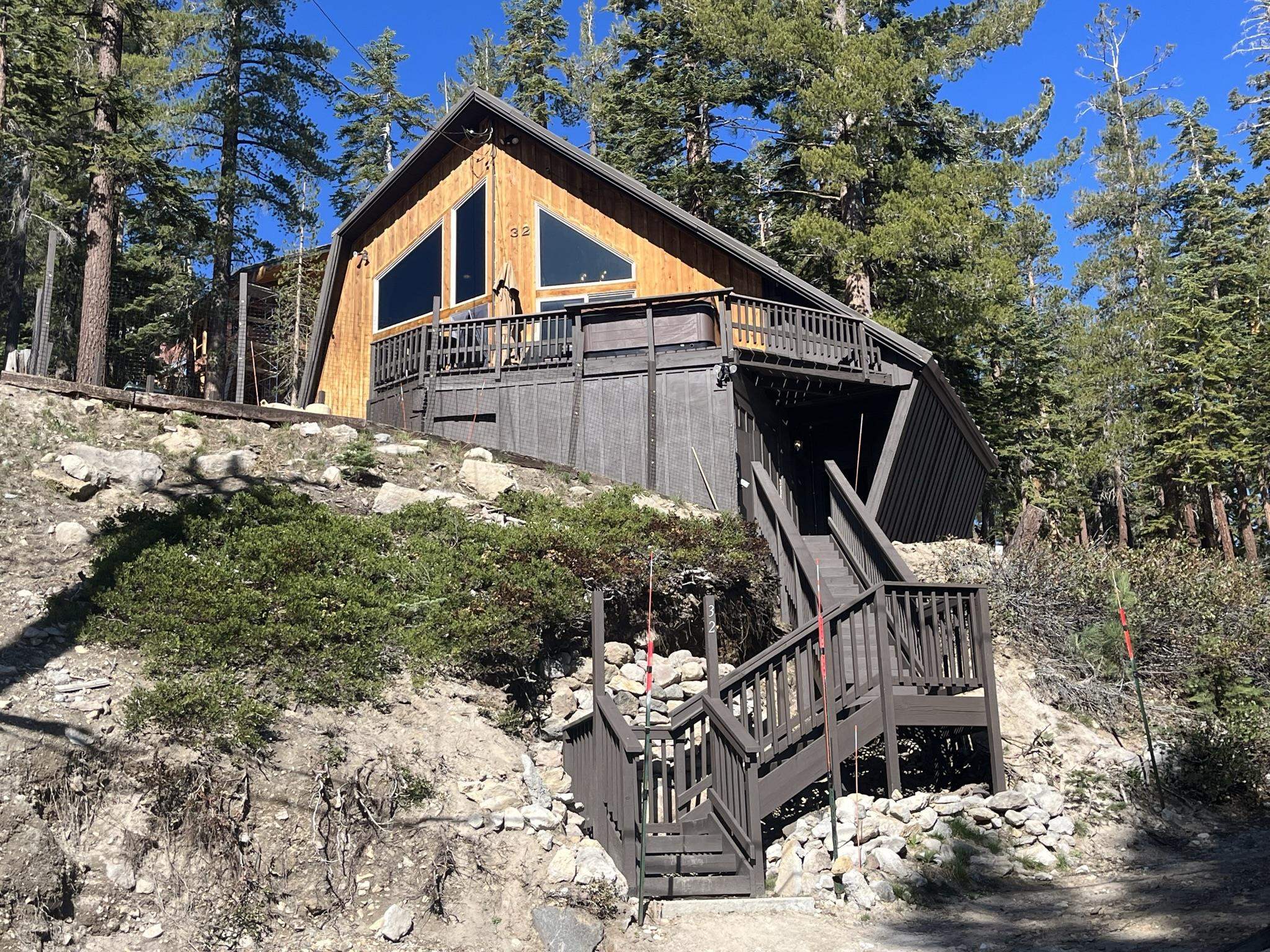32 John Muir Road Mammoth Lakes, CA 93546 - Photo 1 of 42 a front view of a house with a yard