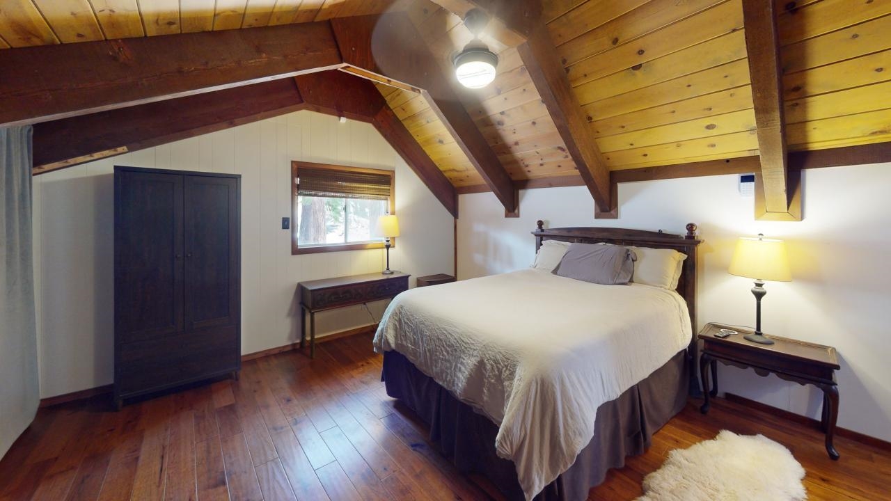 32 John Muir Road Mammoth Lakes, CA 93546 - Photo 15 of 42 a bedroom with a bed and a window