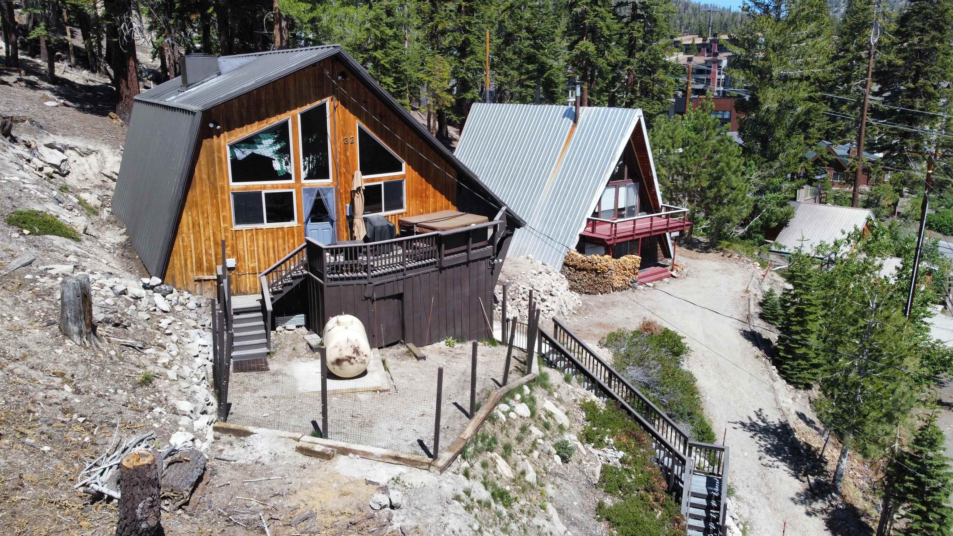 32 John Muir Road Mammoth Lakes, CA 93546 - Photo 35 of 42 a view of a white house with large trees