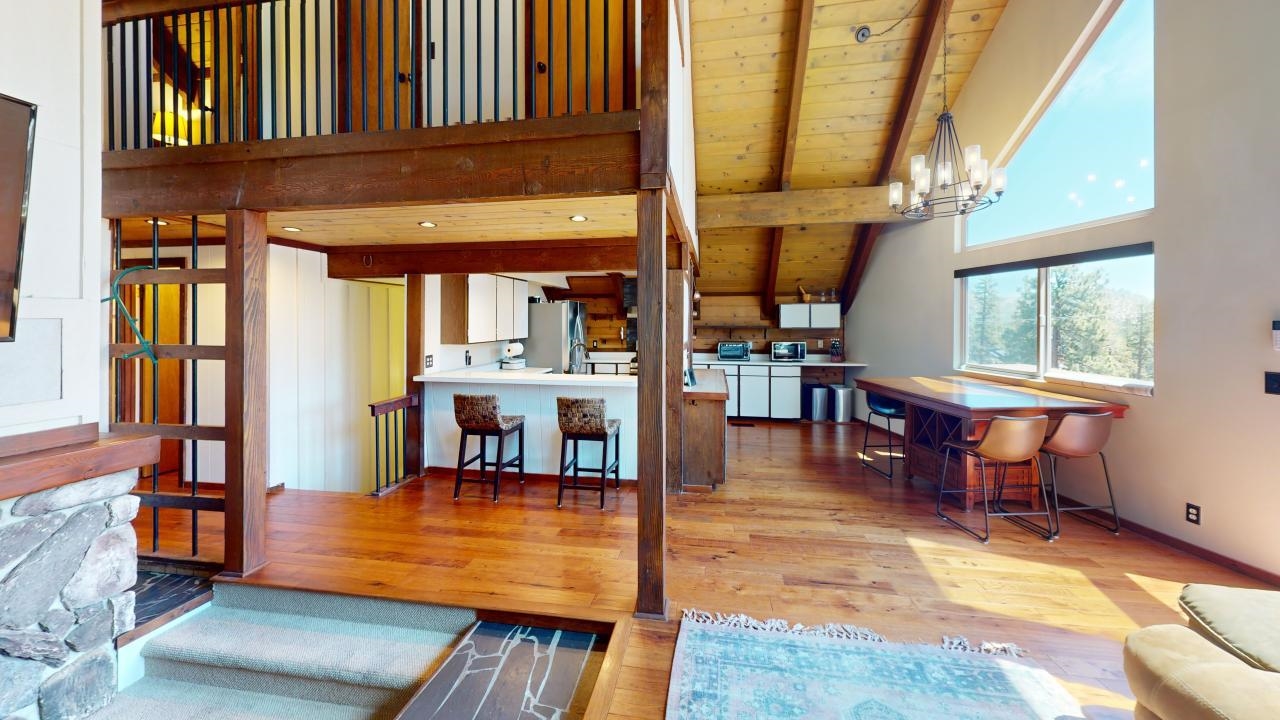32 John Muir Road Mammoth Lakes, CA 93546 - Photo 7 of 42 a view of a livingroom with furniture window and wooden floor