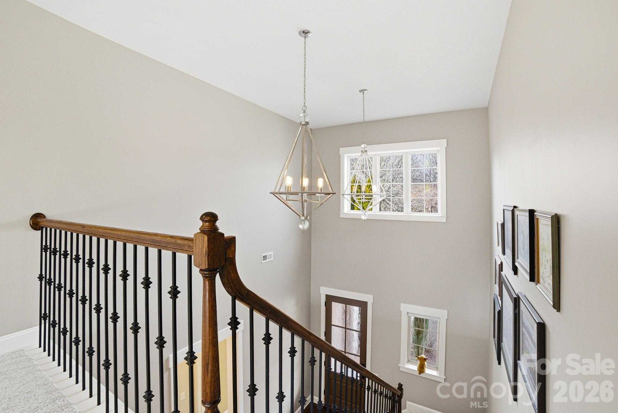 17413 Robbins Ridge Road Cornelius, NC 28031 - Photo 36 of 48 a view of a hallway with windows