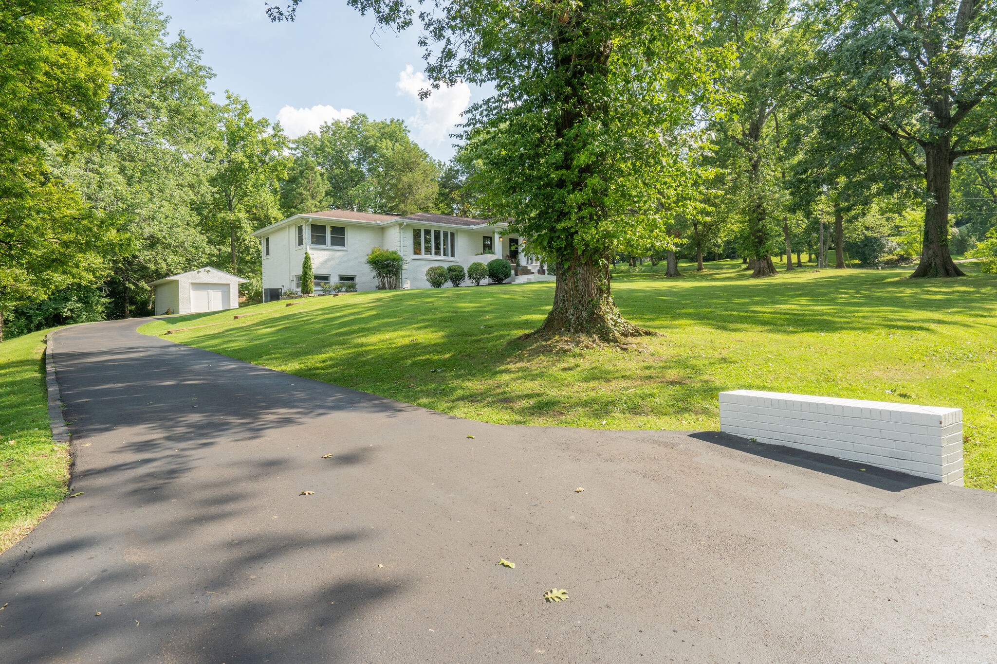 6357 Torrington Road Nashville, TN 37205 - Photo 2 of 48 a view of a house with backyard and a tree