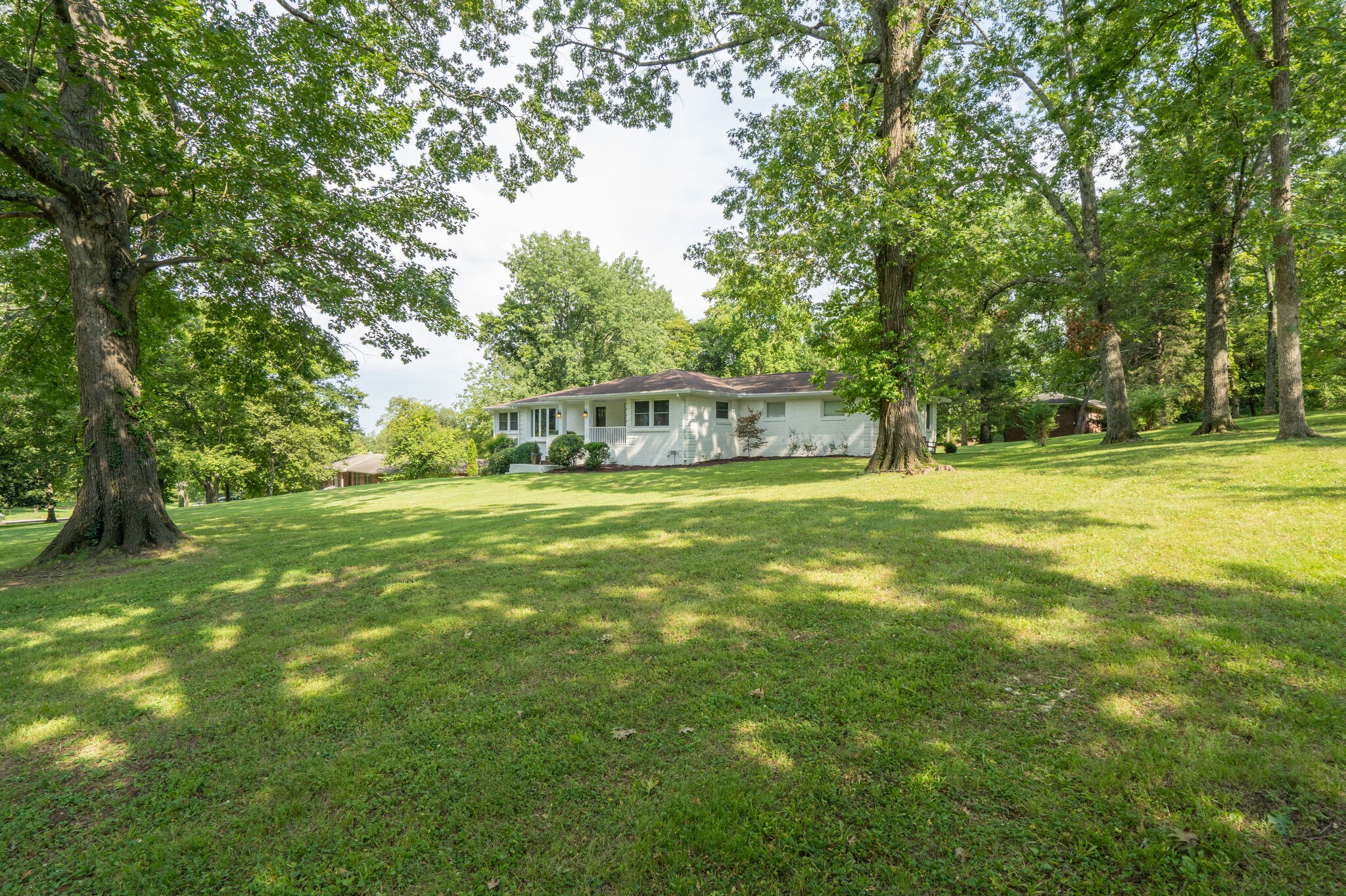 6357 Torrington Road Nashville, TN 37205 - Photo 3 of 48 a view of a house with a big yard