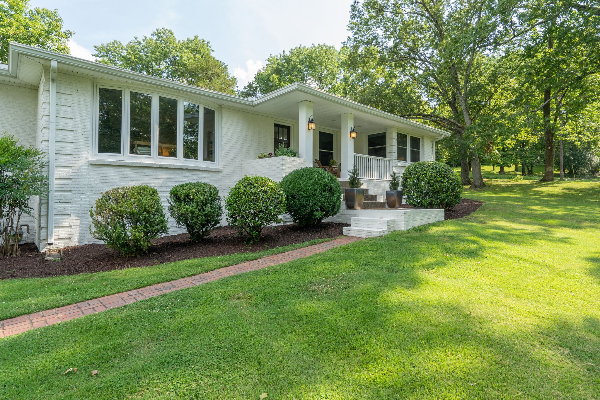6357 Torrington Road Nashville, TN 37205 - Photo 4 of 48 a front view of a house with garden