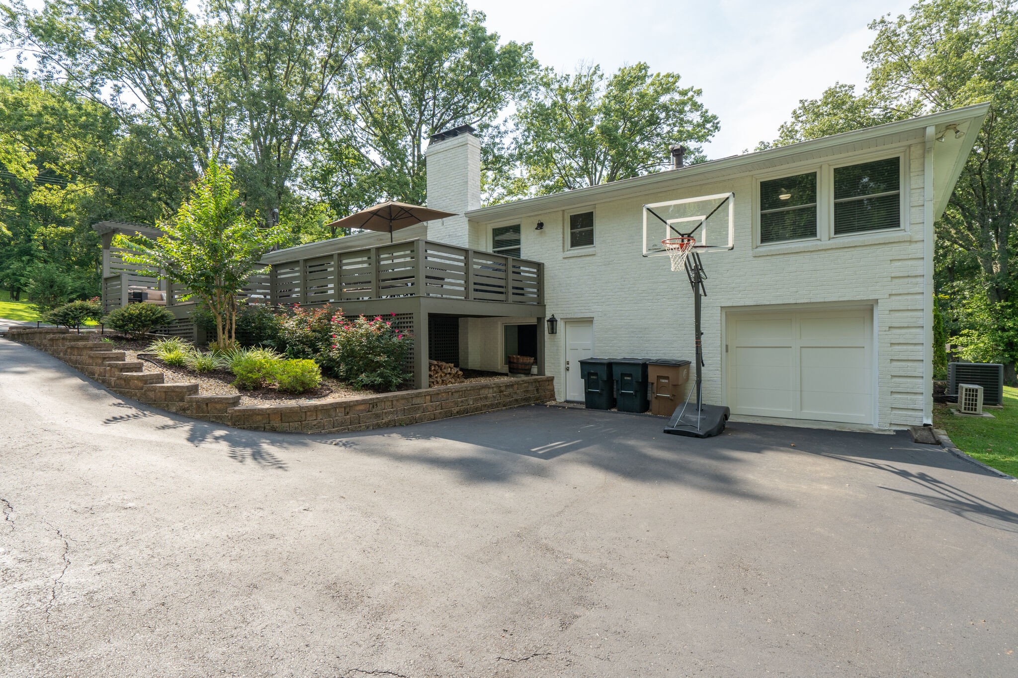 6357 Torrington Road Nashville, TN 37205 - Photo 48 of 48 a front view of a house with a yard and garage