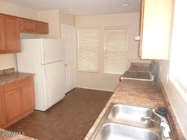 a view of a kitchen with a dishwasher and cabinet