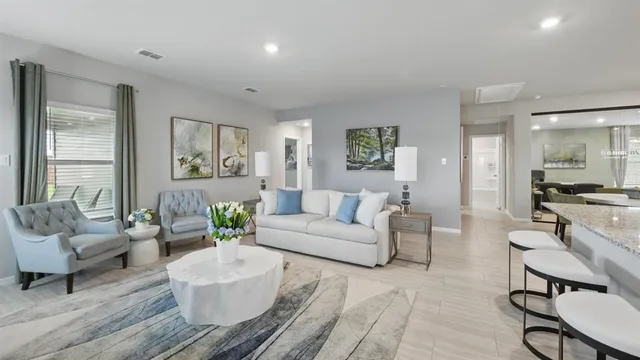 a dining room with furniture and window
