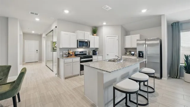 a view of a dining room with furniture