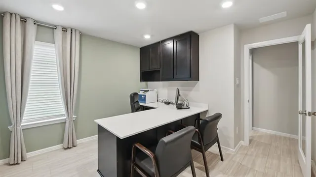 a work room with furniture and a window