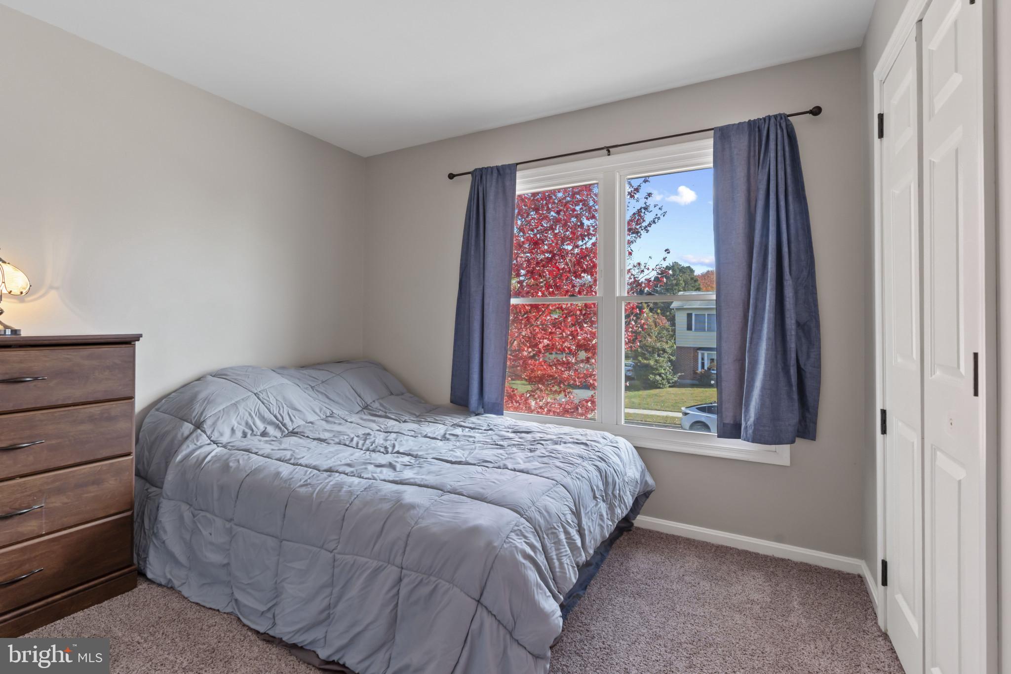 622 North West Street Dover, DE 19904 - Photo 15 of 23 a bed sitting in a bedroom next to a window
