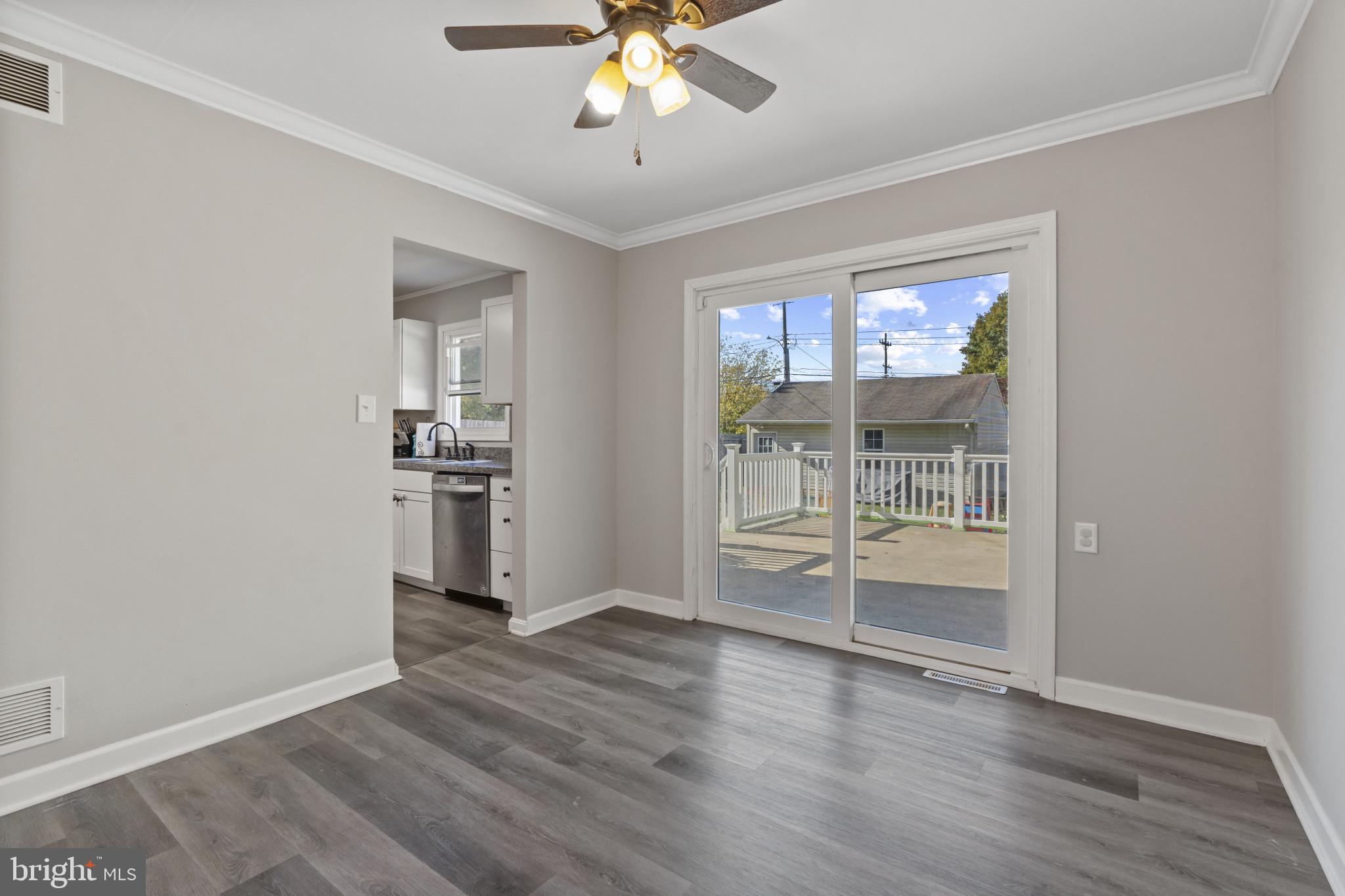 622 North West Street Dover, DE 19904 - Photo 6 of 23 wooden floor in an empty room with a window