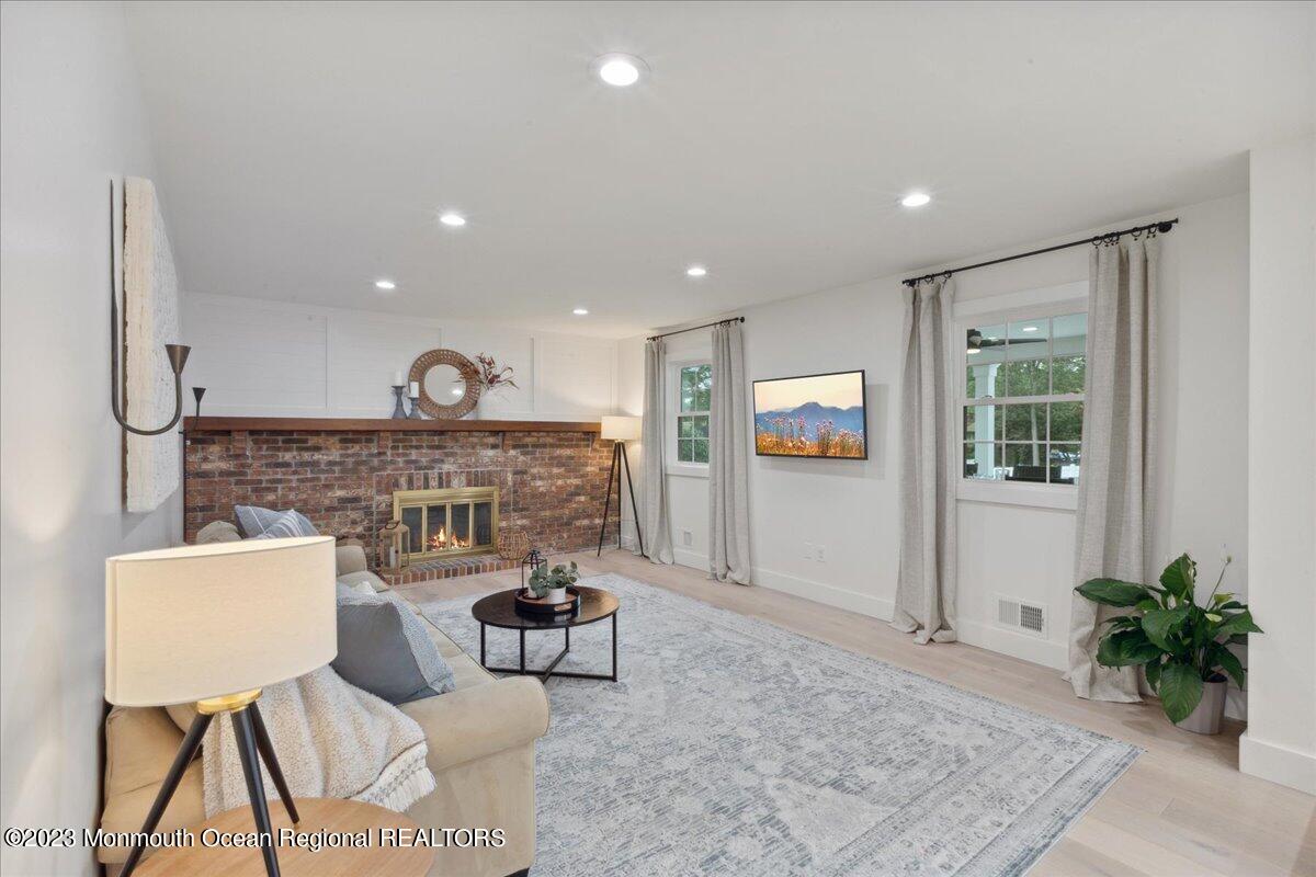 17 Quaker Road Middletown, NJ 07748 - Photo 15 of 65 a living room with furniture and a potted plant