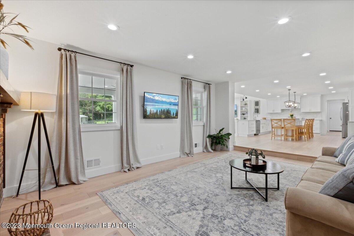 17 Quaker Road Middletown, NJ 07748 - Photo 16 of 65 a living room with furniture and a rug