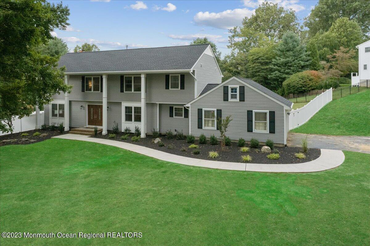 17 Quaker Road Middletown, NJ 07748 - Photo 2 of 65 a front view of a house with a yard