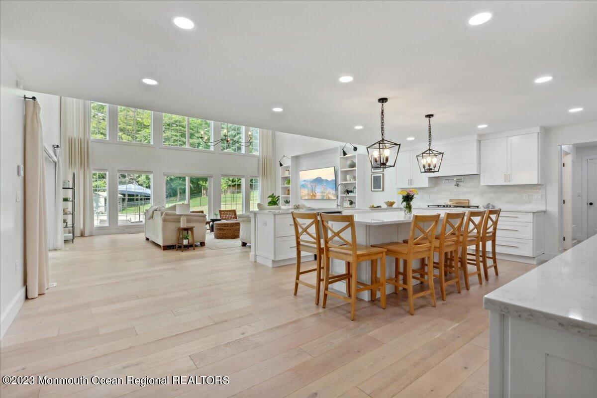 17 Quaker Road Middletown, NJ 07748 - Photo 26 of 65 a large kitchen with a table and chairs