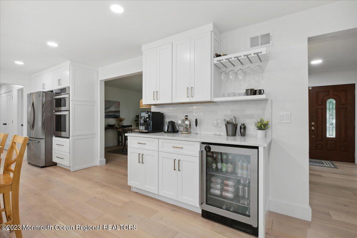 17 Quaker Road Middletown, NJ 07748 - Photo 27 of 65 a kitchen with stainless steel appliances granite countertop a refrigerator and a stove top oven