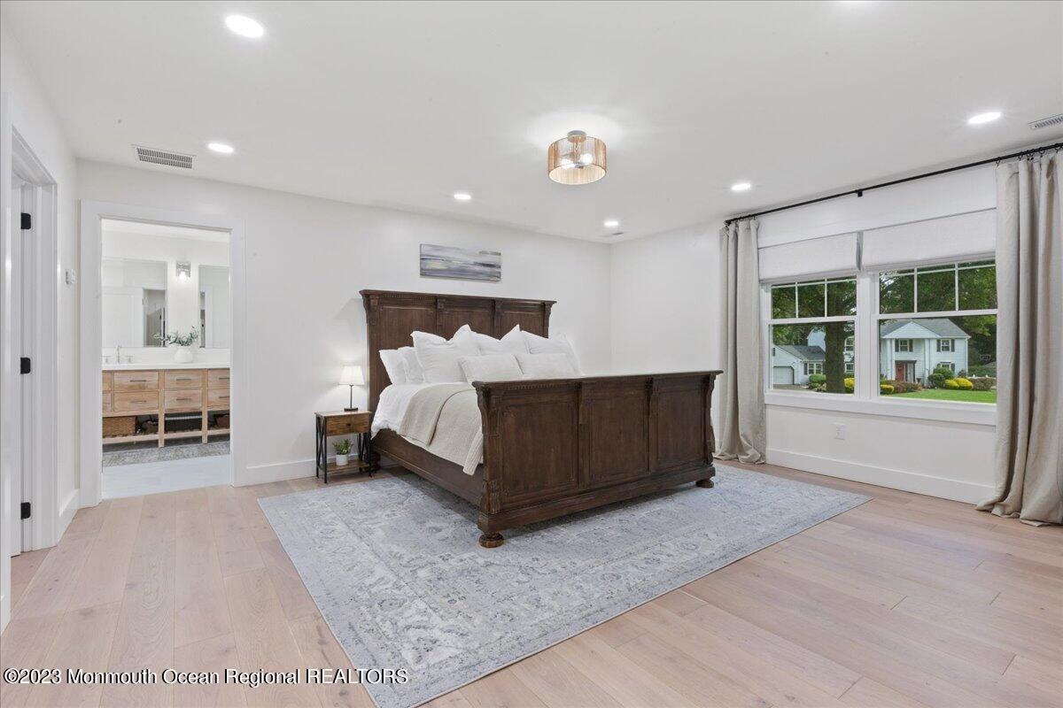 17 Quaker Road Middletown, NJ 07748 - Photo 29 of 65 a bedroom with a bed and a large window