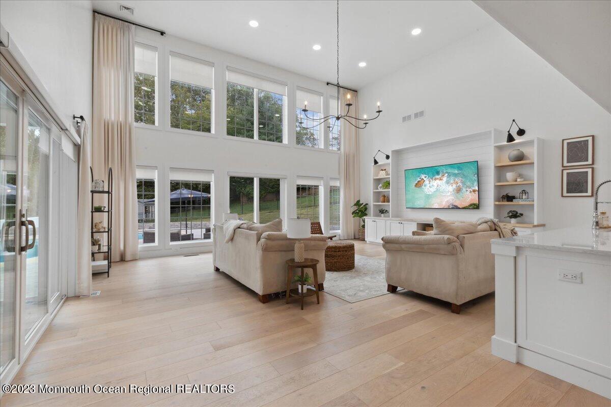 17 Quaker Road Middletown, NJ 07748 - Photo 3 of 65 a living room with furniture and large windows