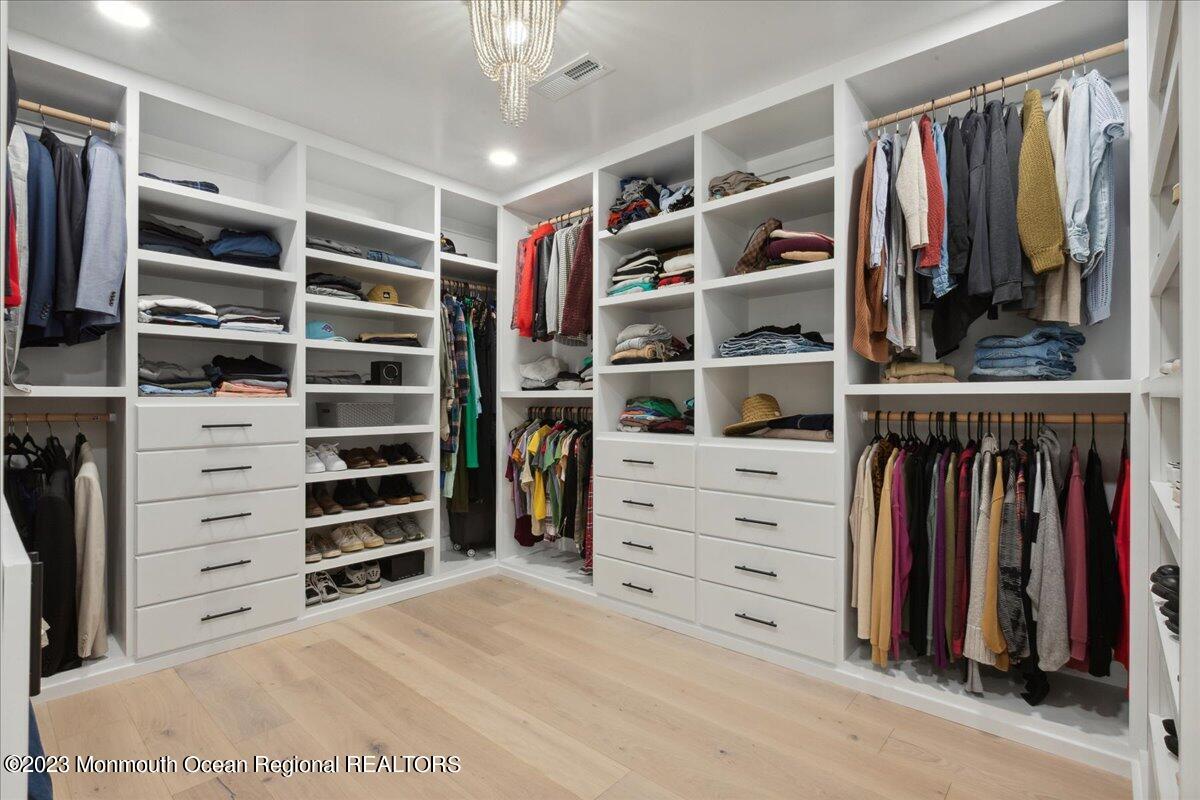 17 Quaker Road Middletown, NJ 07748 - Photo 31 of 65 a view of walk in closet with clothes and shoes