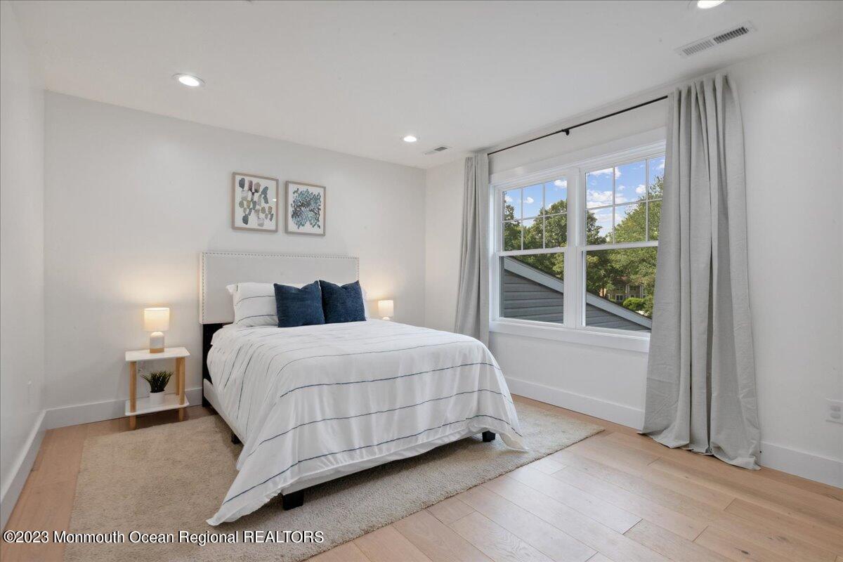 17 Quaker Road Middletown, NJ 07748 - Photo 37 of 65 a bedroom with a bed and a window