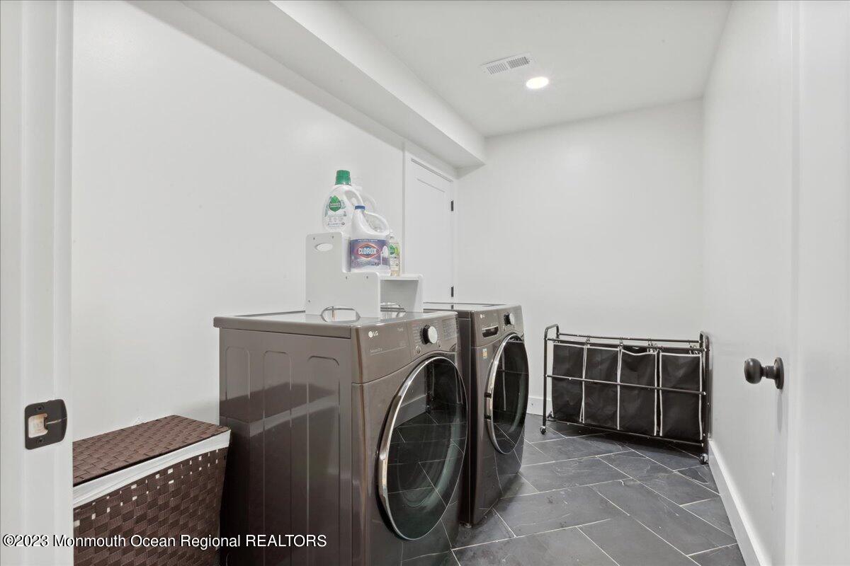 17 Quaker Road Middletown, NJ 07748 - Photo 41 of 65 a utility room with dryer and washer