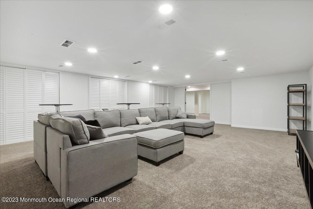 17 Quaker Road Middletown, NJ 07748 - Photo 45 of 65 a living room with furniture and a large window