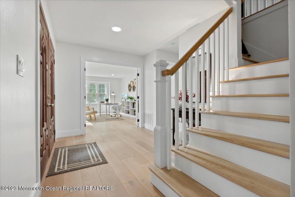 17 Quaker Road Middletown, NJ 07748 - Photo 8 of 65 a view of entryway and hall with wooden floor