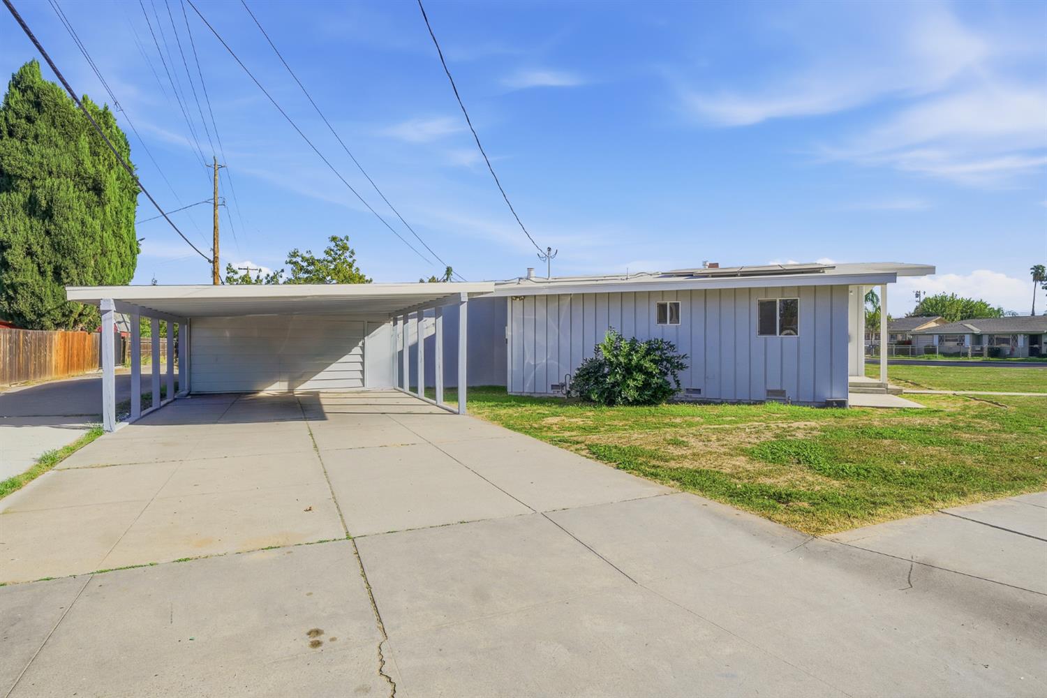 2240 Olive Street Selma, CA 93662 - Photo 3 of 38 a view of a house with a yard and potted plants