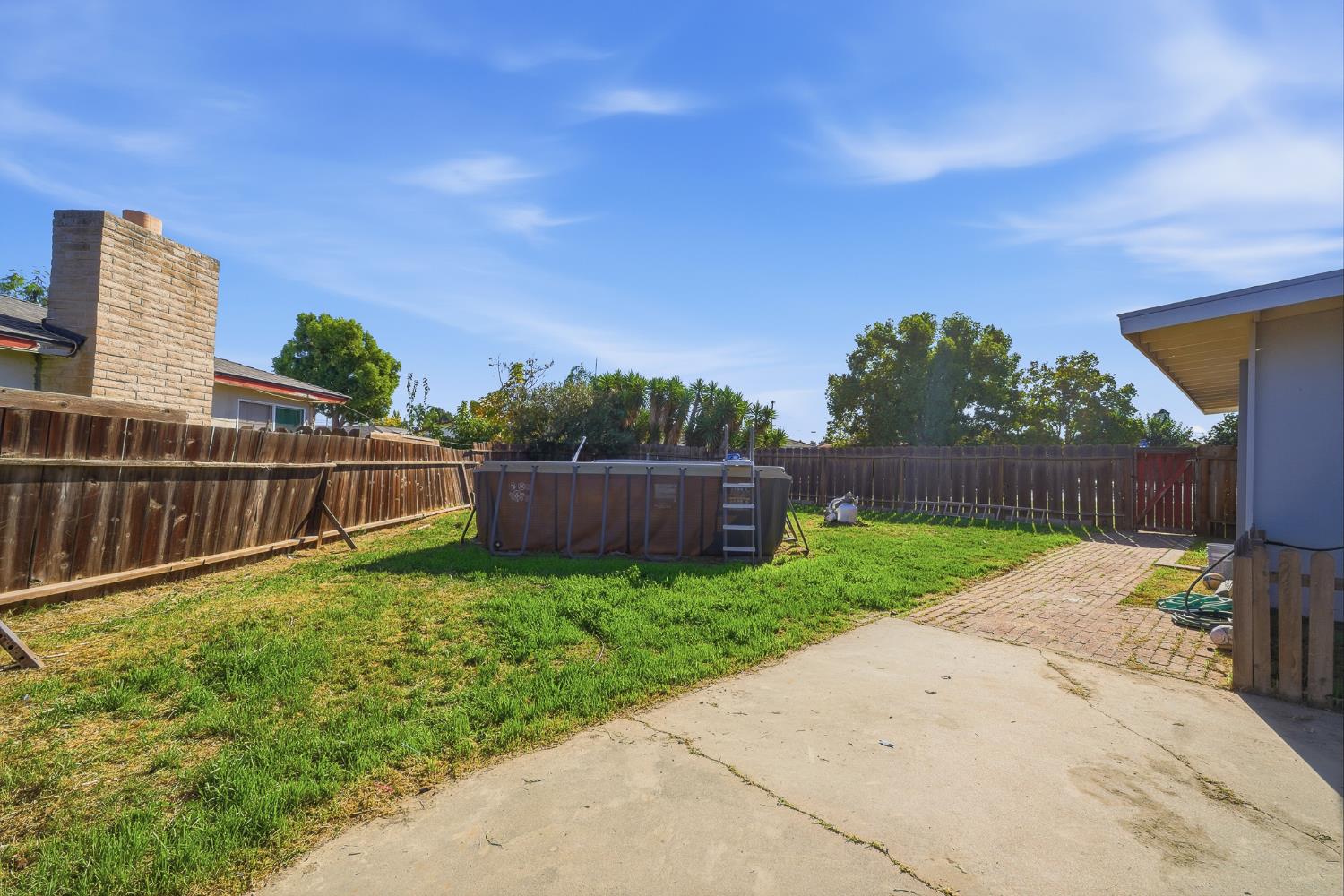 2240 Olive Street Selma, CA 93662 - Photo 38 of 38 a view of a backyard with wooden fence