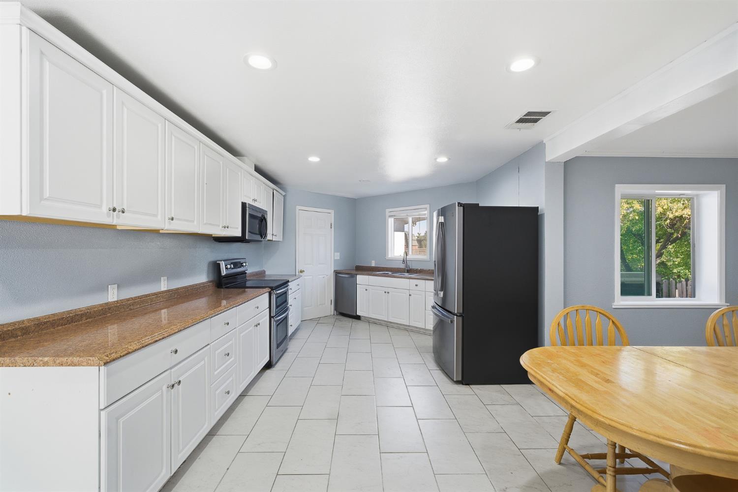 2240 Olive Street Selma, CA 93662 - Photo 10 of 38 a kitchen with refrigerator and cabinets