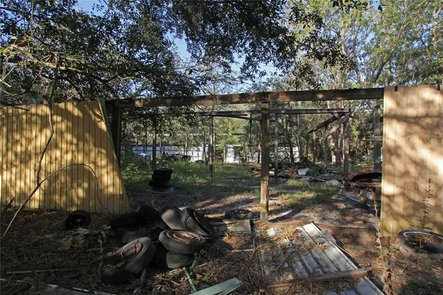 a view of a yard with a tree