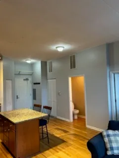 a kitchen with stainless steel appliances granite countertop a sink and cabinets