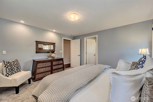 a bedroom with a bed and a couch