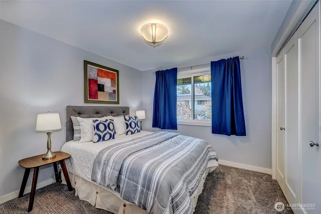 a bedroom with bed and window