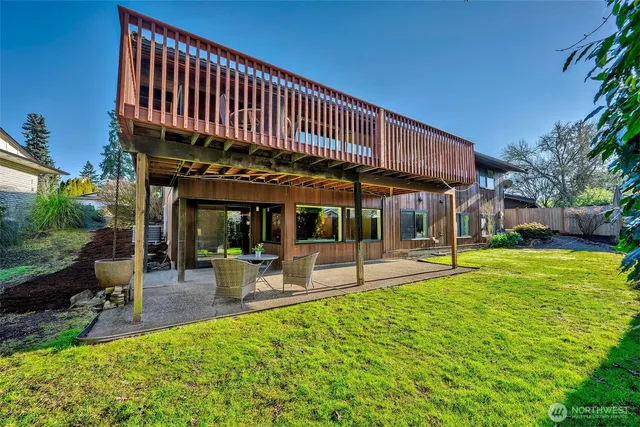 a view of a house with a yard patio and sitting area