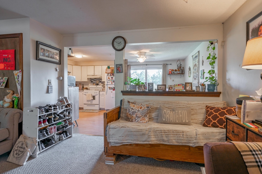 11 Shawnee Road Pepperell, MA 01463 - Photo 15 of 22 a living room with furniture and a large window