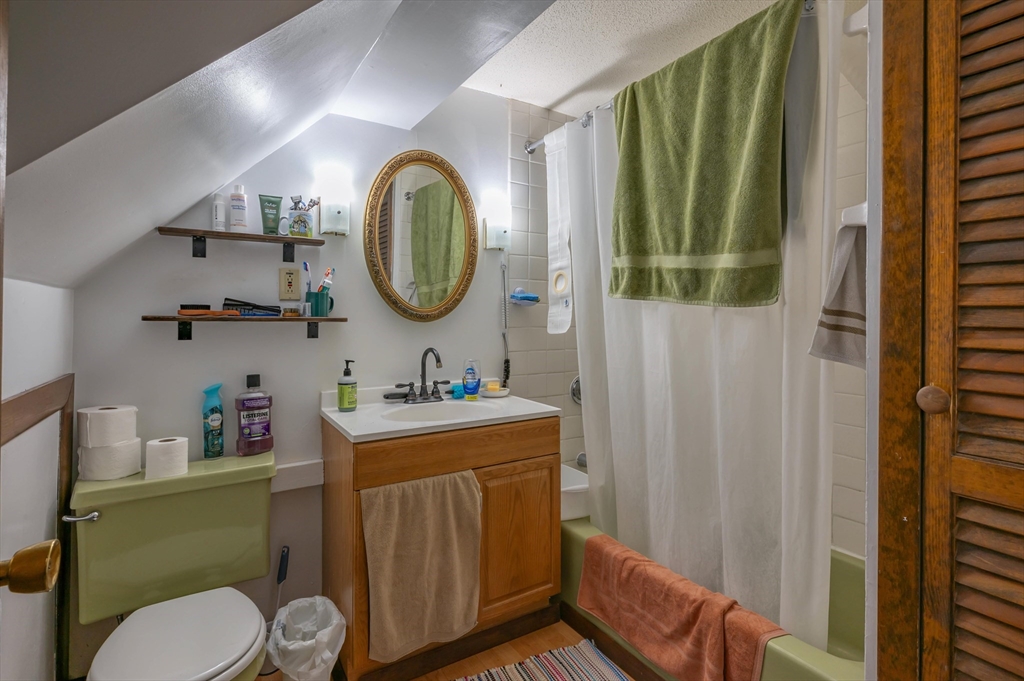 11 Shawnee Road Pepperell, MA 01463 - Photo 17 of 22 a bathroom with a toilet mirror vanity and vanity