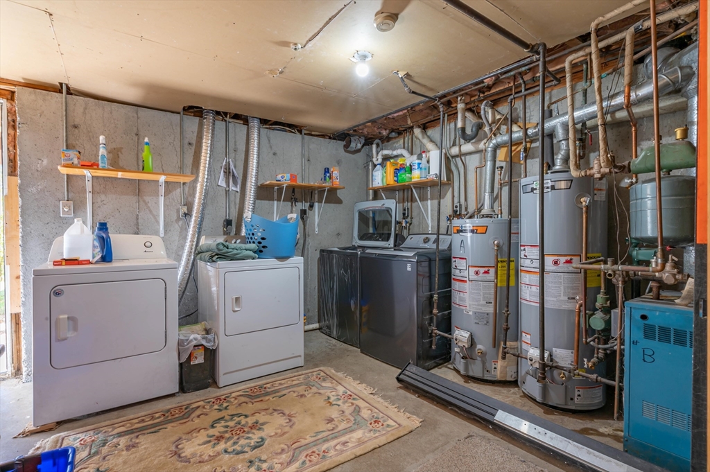 11 Shawnee Road Pepperell, MA 01463 - Photo 18 of 22 a storage room with cabinets