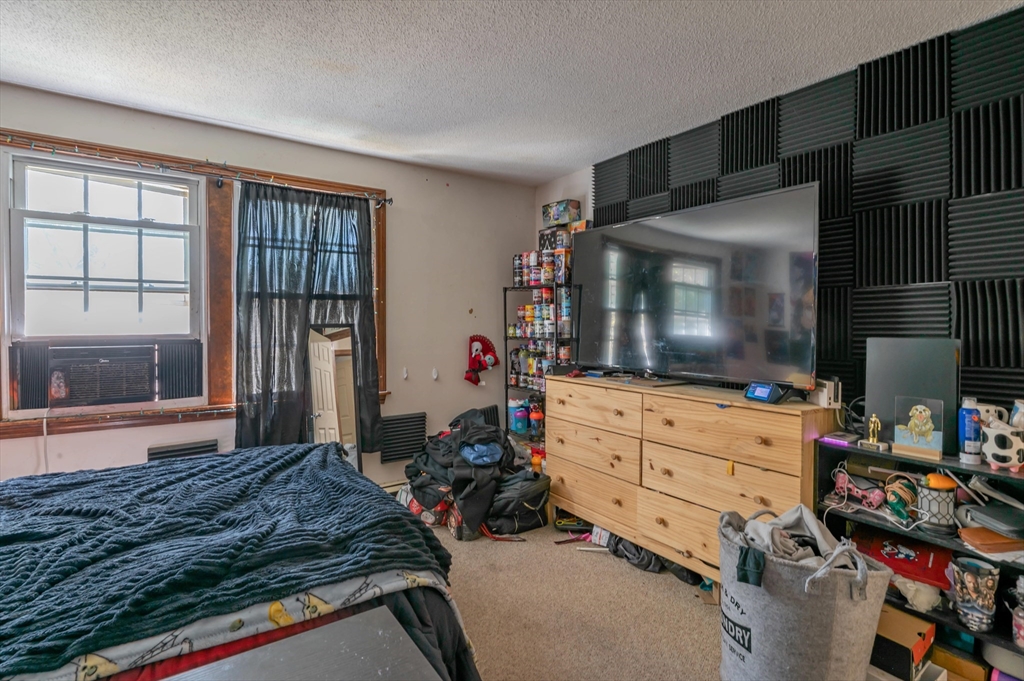 11 Shawnee Road Pepperell, MA 01463 - Photo 9 of 22 a room with storage and flat screen tv
