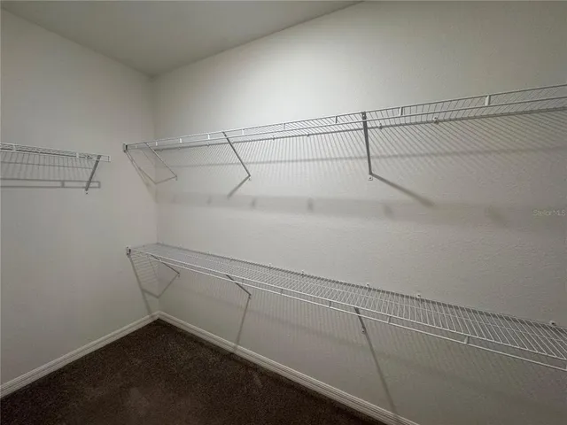 a view of a room with racks on the wall