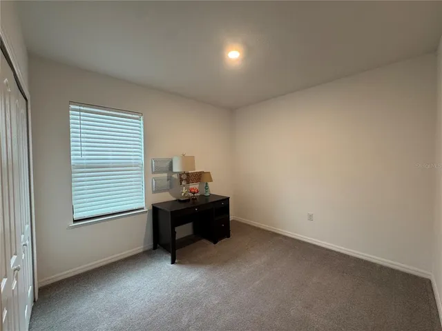 a room with furniture and a window