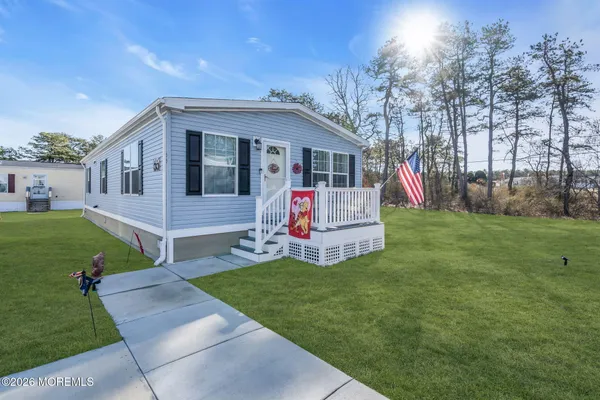 a view of house with backyard