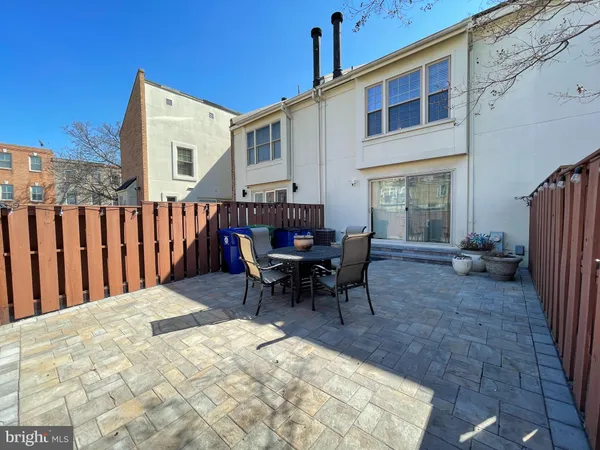 a view of a dinning table and chairs in patio