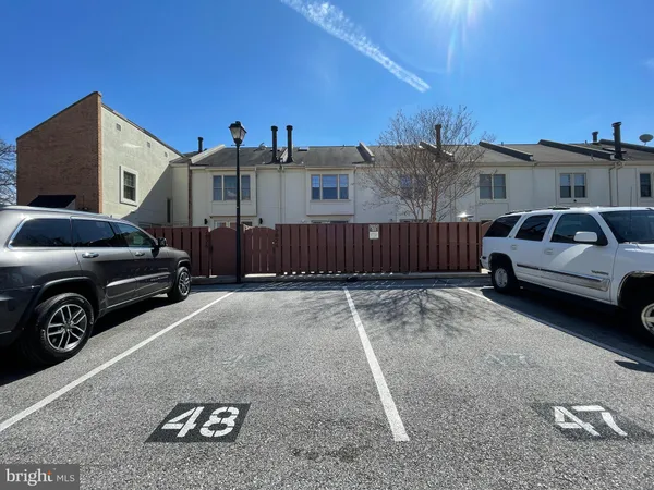 a view of a car parked in back of a house