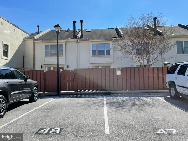 a view of a car park in front of house